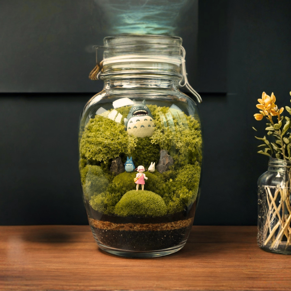 Anime terrarium met groen mos en kleine figuurtjes, gemaakt in de terrarium workshop door Miniatures Guild